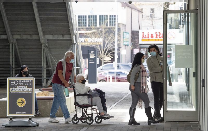 March12, An elderly woman in a wheel chair is escorted into The NYC vaccination site located at The Empire Outlets in Staten Island, New York. Mandatory credit: Kostas Lymperopoulos/CSM
NEWS Covid-19, New York, USA - 12 Mar 2021,Image: 597131260, License: Rights-managed, Restrictions: , Model Release: no, Credit line: Profimedia