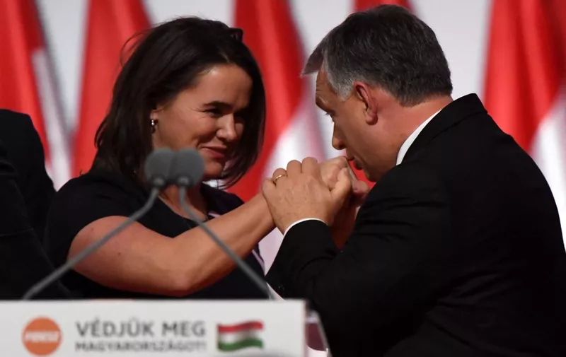 Reelected chairman of the governing FIDESZ party, Hungarian Prime Minister Viktor Orban, greets with hand kiss elected party deputy-chairman, Hungarian Minister of State for Family and Youth Affairs Katalin Novak (L), during the party congress at the Hungexpo fair center in Budapest on November 12, 2017. (Photo by ATTILA KISBENEDEK / AFP)