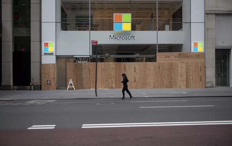 A looted and boarded up Microsoft store is seen after a night of protest over the death of an African-American man George Floyd in Minneapolis on June 2, 2020 in Manhattan in New York City. - New York's mayor Bill de Blasio yesterday declared a city curfew from 11:00 pm to 5:00 am, as sometimes violent anti-racism protests roil communities nationwide. Saying that "we support peaceful protest," De Blasio tweeted he had made the decision in consultation with the state's governor Andrew Cuomo, following the lead of many large US cities that instituted curfews in a bid to clamp down on violence and looting. (Photo by Johannes EISELE / AFP)
