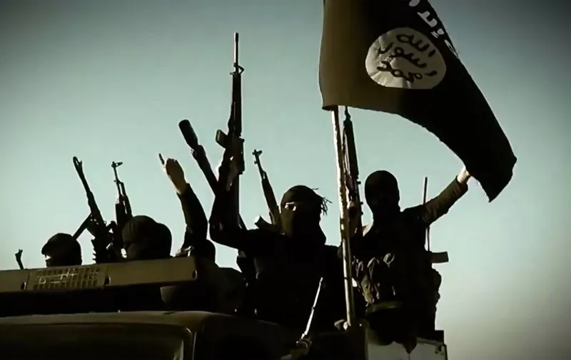 An image grab taken from a propaganda video released on March 17, 2014 by the Islamic State of Iraq and the Levant (ISIL)'s al-Furqan Media allegedly shows ISIL fighters raising their weapons as they stand on a vehicle mounted with the trademark Jihadists flag at an undisclosed location in the Anbar province. The jihadist Islamic State of Iraq and the Levant group has spearheaded a major offensive that began on June 9, 2014 and has since overrun all of Iraq's northern Nineveh province. AFP PHOTO / HO / AL-FURQAN MEDIA 
=== RESTRICTED TO EDITORIAL USE - MANDATORY CREDIT "AFP PHOTO / HO / AL-FURQAN MEDIA" - NO MARKETING NO ADVERTISING CAMPAIGNS - DISTRIBUTED AS A SERVICE TO CLIENTS FROM ALTERNATIVE SOURCES, AFP IS NOT RESPONSIBLE FOR ANY DIGITAL ALTERATIONS TO THE PICTURE'S EDITORIAL CONTENT, DATE AND LOCATION WHICH CANNOT BE INDEPENDENTLY VERIFIED ===
