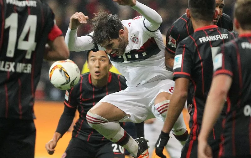 Bayern Munich's Spanish midfielder Javier Martinez (C) vies for the ball with Frankfurt's players during the German first division Bundesliga football match Eintracht Frankfurt vs FC Bayern Munich in Frankfurt am Main, western Germany, on October 30, 2015.    AFP PHOTO / DANIEL ROLAND

RESTRICTIONS: DURING MATCH TIME: DFL RULES TO LIMIT THE ONLINE USAGE TO 15 PICTURES PER MATCH AND FORBID THE IMAGE SEQUENCES TO SIMULATE VIDEO.
== RESTRICTED TO EDITORIAL USE == 
FOR FURTHER QUERIES PLEASE CONTACT DFL DIRECTLY AT + 49 69 650050.