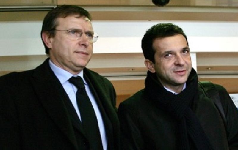 Catania football team President Antonino Pulvirenti  (R) and Catania chief executive Pietro Lo Monaco leave a Rome Fiumicino airport hotel after a meeting with soccer league officials, 06 February 2006. Italy's government vowed on Tuesday to push ahead with tough new security measures including closed-door matches for all stadiums which do not reach safety standards to battle the plague of hooliganism which claimed the life of a policeman at a match on Friday.    AFP PHOTO/Filippo MONTEFORTE