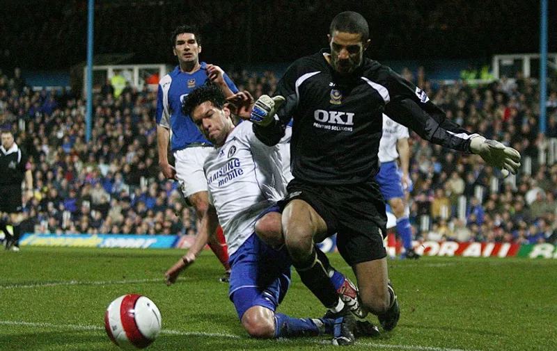 Chelsea's Michael Ballack (L) tackles by Portsmouth's 'keeper David James during the Premiership match between Portsmouth and Chelsea,  at Fratton Park, Portsmouth, 03 March 2007. Player in background is unidentified.     AFP PHOTO CHRIS YOUNG
Mobile and website uses of domestic English football pictures subject to subscription of a licence with Football Association Premier League (FAPL) tel: +44 207 298 1656. For newspapers where the football content of the printed and electronic versions are identical, no licence is necessary.