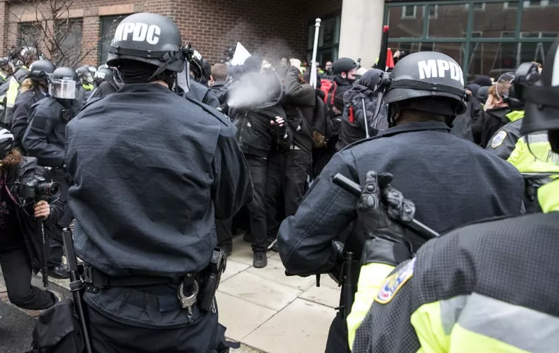 Police officers pepper spray a group of protestors before the inauguration of President-elect Donald Trump January 20, 2017 in Washington, DC.  


Donald Trump was sworn in as the 45th president of the United States Friday -- capping his improbable journey to the White House and beginning a four-year term that promises to shake up Washington and the world. / AFP PHOTO / ZACH GIBSON