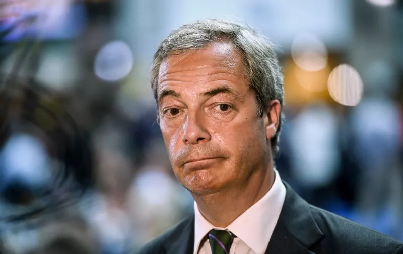 Leader of the United Kingdom Independence Party (UKIP) Nigel Farage looks on during an European Union summit meeting on June 28, 2016 at the EU headquarters in Brussels. 
Britain's exit from the European Union may erode the bloc's leadership role in fighting climate change and stymie crucial efforts to set more ambitious targets for cutting greenhouse gases, officials and experts said on June 28. European leaders meeting in Brussels pressured British Prime Minister David Cameron Tuesday to launch the two-year withdrawal process "as soon as possible", but the embattled premier has vowed he will leave that task to a successor to be named on September 9.  / AFP PHOTO / PHILIPPE HUGUEN