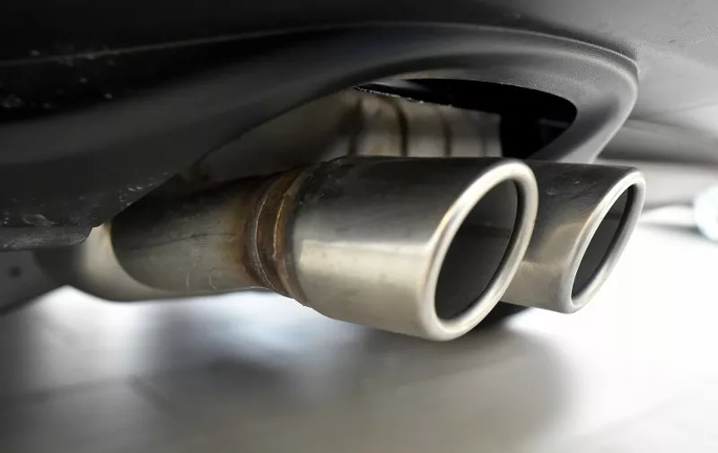 (FILES) This file photo taken on March 24, 2016 shows exhaust pipes seen on a Volkswagen vehicle at an auto dealership in San Francisco.
Around 630,000 Audi, Mercedes, Opel, Porsche and Volkswagen cars are to be recalled in Europe owing to irregularities in their emissions values, a German government source told AFP on April 20, 2016. 
 / AFP PHOTO / Josh Edelson