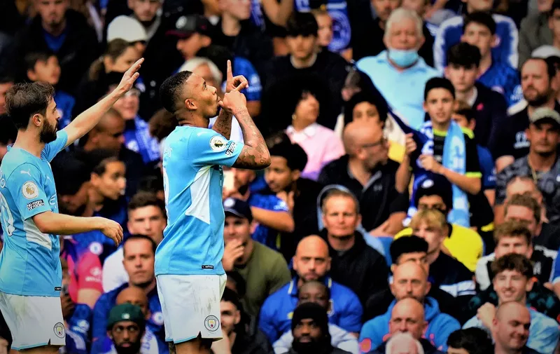 Manchester City's Gabriel Jesus, right, celebrates with Manchester City's Bernardo Silva after scoring his side's opening goal during the English Premier League soccer match between Chelsea and Manchester City at Stamford Bridge Stadium in London, Saturday, Sept. 25, 2021. (AP Photo/Alastair Grant)