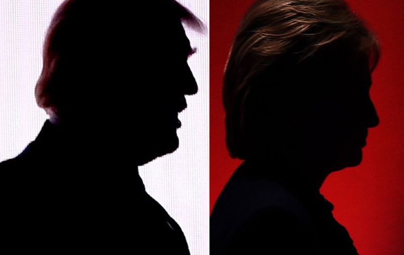 This combination of file photos shows the silhouettes of Republican presidential nominee Donald Trump(R)July 18, 2016 and Democratic presidential nominee Hillary Clinton on February 4, 2016.
Hillary Clinton and Donald Trump prepared to square off September 26, 2016 in their first presidential debate -- a keenly awaited clash that comes as they sit nearly neck and neck in the polls. The debate, which is expected to be watched by tens of millions of Americans, could draw a record number of viewers when it kicks off at 9:00 pm EST (0100 GMT Tuesday).
 / AFP PHOTO / DESK