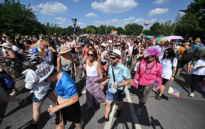 People take part in the LGBTQ+ (lesbian, gay, bisexual, transgender, queer and others) Pride Parade in Budapest, Hungary, on July 15, 2023 in memory of the Stonewall Riots, the first big uprising of homosexuals against police assaults in New York City on June 27, 1969. (Photo by ATTILA KISBENEDEK / AFP)