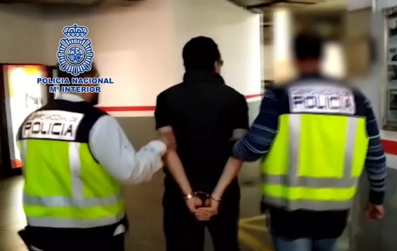 This image grab taken from a video released on February 12, 2020 by the Spanish Police shows Emilio Lozoya, former chief executive of Mexico's state oil company PEMEX, surrounded by Spanish policemen after his arrest in Malaga. - Emilio Lozoya, PEMEX chief from 2012-18, is accused of accepting millions of dollars in bribes from scandal-tainted Brazilian construction giant Odebrecht. (Photo by - / Spanish Police / AFP) / RESTRICTED TO EDITORIAL USE - MANDATORY CREDIT "AFP PHOTO /HANDOUT/SPANISH POLICE" - NO MARKETING - NO ADVERTISING CAMPAIGNS - DISTRIBUTED AS A SERVICE TO CLIENTS