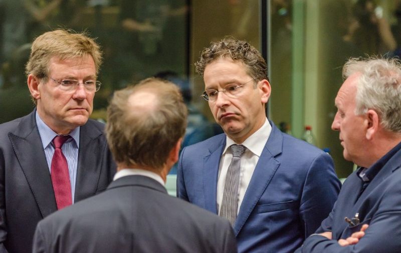 Dutch Finance Minister and chair of the eurogroup Jeroen Dijsselbloem (R) and Belgium's Finance Minister Johan Van Overtveldt (L) during a round table meeting of eurozone finance ministers.