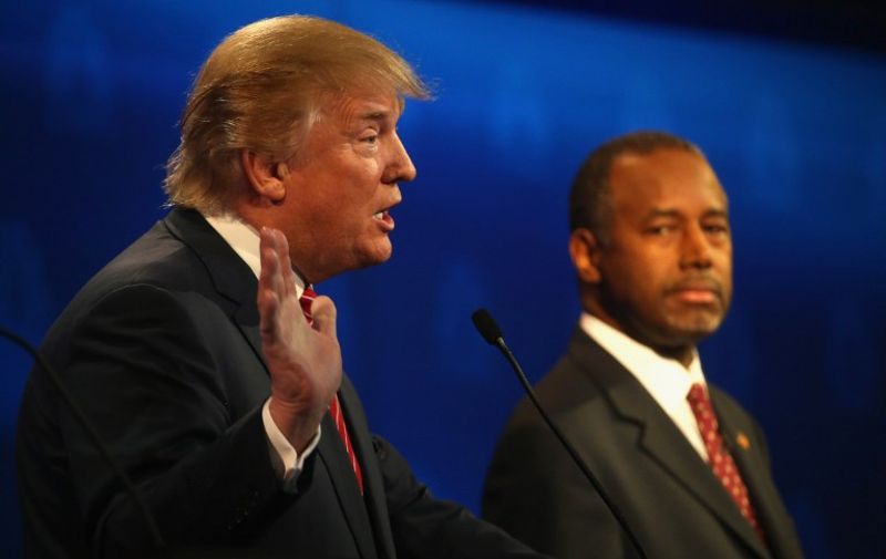 BOULDER, CO - OCTOBER 28: Presidential candidate Donald Trump speaks while Ben Carson looks on during the CNBC Republican Presidential Debate at University of Colorados Coors Events Center October 28, 2015 in Boulder, Colorado. Fourteen Republican presidential candidates are participating in the third set of Republican presidential debates.   Justin Sullivan/Getty Images/AFP