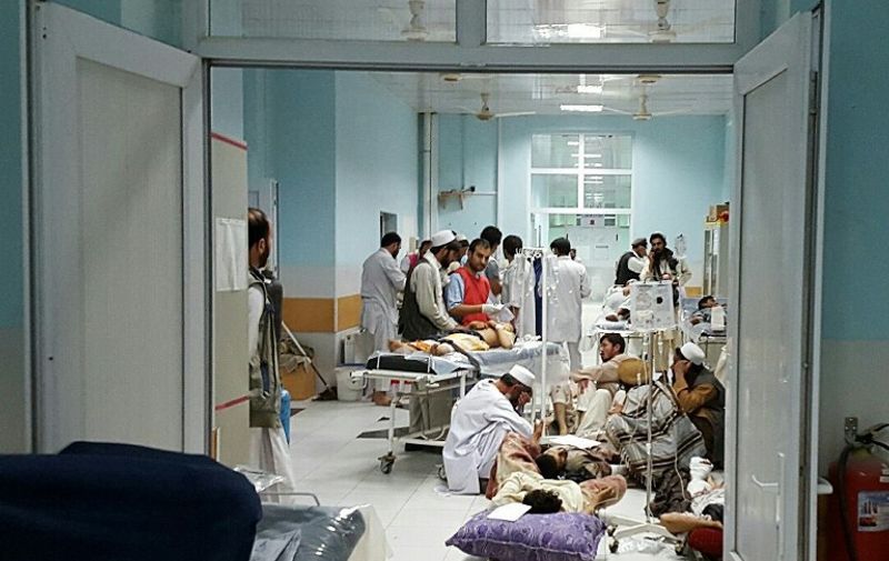 In this undated photograph released by Medecins Sans Frontieres (MSF) on October 3, 2015, Afghan MSF medical personnel treat civilians injured following an offensive against Taliban militants by Afghan and coalition forces at the MSF hospital in Kunduz. An air strike on the hospital in the Afghan city of Kunduz on October 3 left three Doctors Without Borders staff dead and dozens more unaccounted for, the medical charity said, with NATO conceding US forces may have been behind the bombing. The MSF facility is seen as a key medical lifeline in the region and has been running "beyond capacity" during recent fighting that saw the Taliban seize control of the provincial capital for several days. AFP PHOTO / MSF ----EDITORS NOTE---- RESTRICTED TO EDITORIAL USE - MANDATORY CREDIT "AFP PHOTO/MSF" - NO MARKETING NO ADVERTISING CAMPAIGNS - DISTRIBUTED AS A SERVICE TO CLIENTS -----