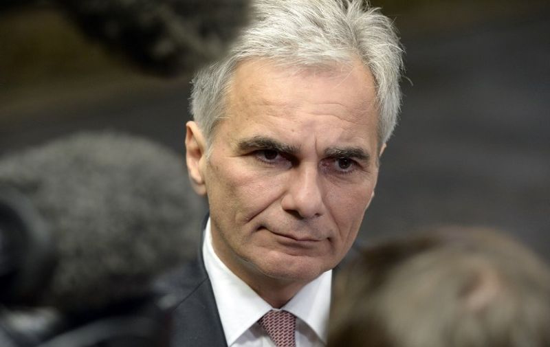 (FILES) This file photo taken on June 22, 2015 shows Austria's Chancellor Werner Faymann addressing reporters as he arrives for a meeting at the European Council in Brussels.
Faymann resigned on May 9, 2016, his spokeswoman said, following the triumph by the far-right last month in the first round of presidential elections. / AFP PHOTO / THIERRY CHARLIER