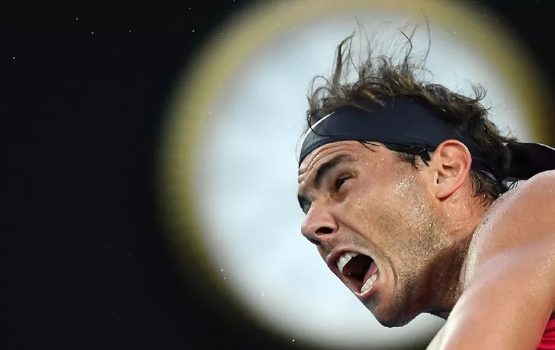 Spain's Rafael Nadal serves against Austria's Dominic Thiem during their men's singles quarter-final match on day ten of the Australian Open tennis tournament in Melbourne on January 29, 2020. (Photo by William WEST / AFP) / IMAGE RESTRICTED TO EDITORIAL USE - STRICTLY NO COMMERCIAL USE