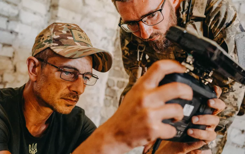 DONETSK, UKRAINE - JUNE 20: Ukrainian soldiers from the Mechanized Brigade are looking at the drone footage during a training assault on trenches in the enclosed training area in Donetsk, Ukraine on June 20, 2023. Wojciech Grzedzinski / Anadolu Agency/ABACAPRESS.COM,Image: 784417100, License: Rights-managed, Restrictions: , Model Release: no