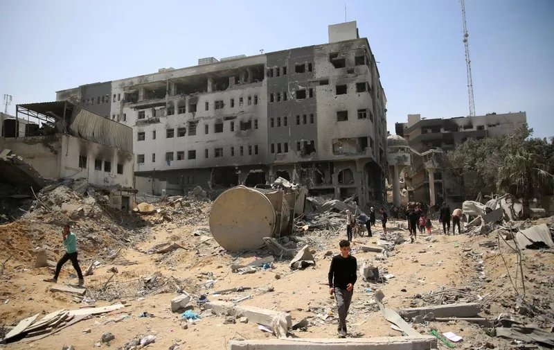 Palestinians inspect the damage at Gaza's Al-Shifa hospital after the Israeli military withdrew from the complex housing the hospital on April 1, 2024, amid the ongoing battles Israel and the Hamas militant group. (Photo by AFP)