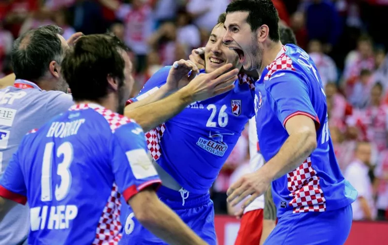 Players of Croatia celebrate their victory over Poland after  their Main Round 1 match of the Men's 2016 EHF European Handball Championships between Poland and Croatia in TAURON Arena of Krakow on January 27, 2016. 
Croatia won 37-23.   / AFP / ATTILA KISBENEDEK