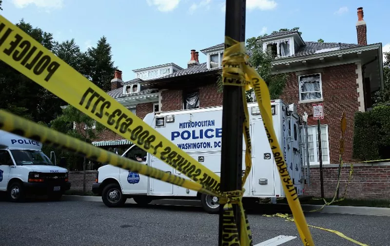 WASHINGTON, DC - MAY 19: District of Columbia Metropolitan Police maintain a perimeter around the house on the 3200 block of Woodland Drive NW May 19, 2015 in Washington, DC. Firefighters discovered the bodies of Savvas Savopoulos, 46, his wife Amy, 47, their 10-year-old son Philip, and the housekeeper, Veralicia Figueroa, 57, last Thursday afternoon when they responded to a blaze at the house. Two Savopoulos daughters were away in boarding school at the time. Investigators have ruled the deaths homicides and say they could continue to collect evidence at the house for another week.   Chip Somodevilla/Getty Images/AFP