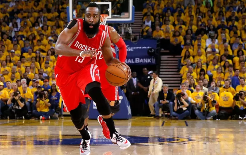 OAKLAND, CA - MAY 27: James Harden #13 of the Houston Rockets drives to the basket in the first half against the Golden State Warriors during game five of the Western Conference Finals of the 2015 NBA Playoffs at ORACLE Arena on May 27, 2015 in Oakland, California. NOTE TO USER: User expressly acknowledges and agrees that, by downloading and or using this photograph, user is consenting to the terms and conditions of Getty Images License Agreement.   Ezra Shaw/Getty Images/AFP