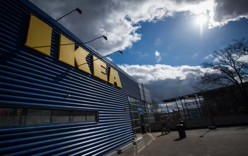 The logo of IKEA is pictured outside Europe's biggest Ikea store in Kungens Kurva, south-west of Stockholm on March 30, 2016. 
Ikea founder Ingvar Kamprad, who built a global business empire with revolutionary flat-pack furniture and dallied with Nazism in his youth, turned 90 today. / AFP PHOTO / JONATHAN NACKSTRAND
