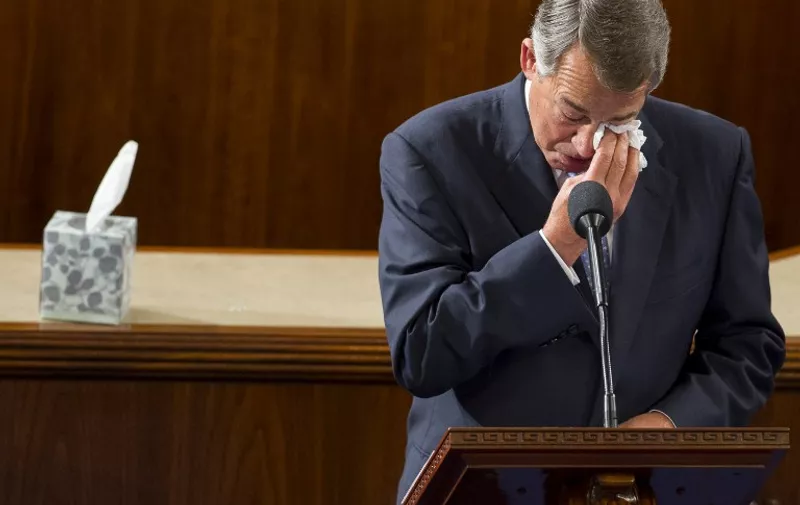 TOPSHOTS
Outgoing Speaker of the House John Boehner, Republican of Ohio, wipes his eyes as he gives a farewell speech from the House floor at the US Capitol in Washington, DC, October 29, 2015. US Representative Paul Ryan, Republican of Wisconsin, is expected to become the new Speaker later today. AFP PHOTO / SAUL LOEB
