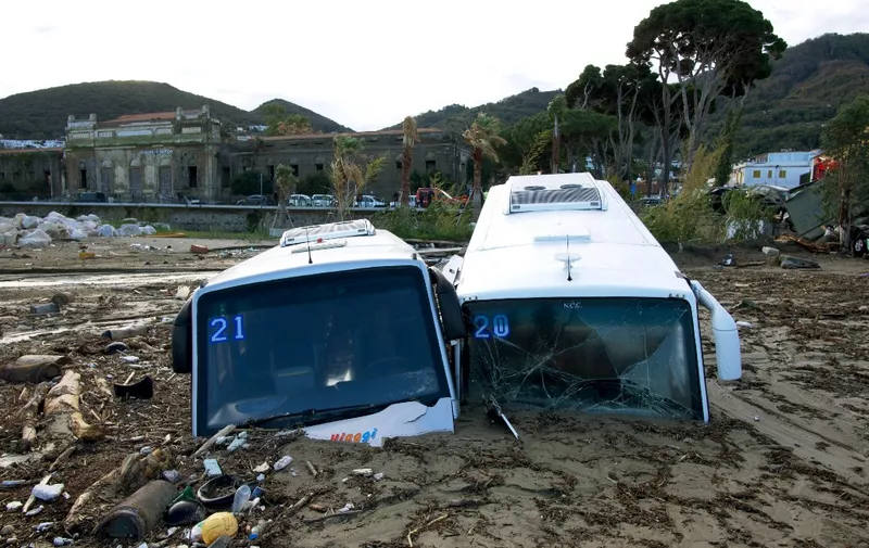 Damaged tourist busess are seen on the port of Casamicciola on November 27, 2022, following heavy rains that caused a landslide on the island of Ischia, southern Italy. - Italian rescuers were searching for a dozen missing people on the southern island of Ischia after a landslide killed at least one person, as the government scheduled an emergency meeting. A wave of mud and debris swept through the small town of Casamicciola Terme early Saturday morning, engulfing at least one house and sweeping cars down to the sea, local media and emergency services said. (Photo by Eliano IMPERATO / AFP)