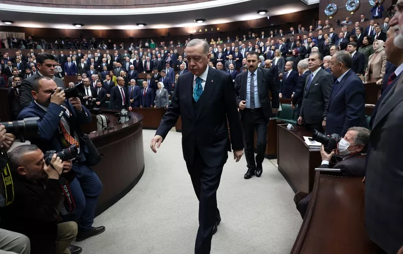 Turkish President and leader of the Justice and Development Party (AK Party), Recep Tayyip Erdogan arrives to deliver a speech during his party's group meeting at the Turkish Grand National Assembly in Ankara, on March 29, 2023. (Photo by Adem ALTAN / AFP)
