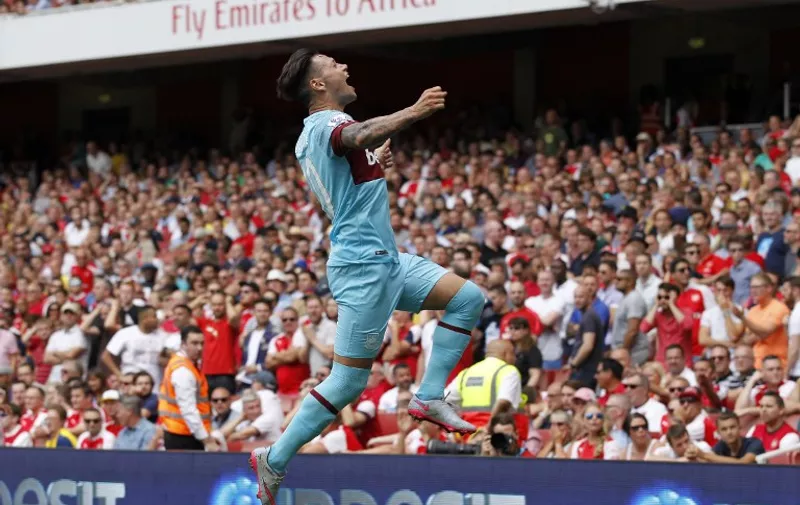 West Ham United's Argentinian striker Mauro Zarate celebrates scoring their second goal during the English Premier League football match between Arsenal and West Ham United at the Emirates Stadium in London on August 9, 2015. AFP PHOTO / IKIMAGES

RESTRICTED TO EDITORIAL USE. No use with unauthorised audio, video, data, fixture lists, club/league logos or "live" services. Online in-match use limited to 45 images, no video emulation. No use in betting, games or single club/league/player publications.