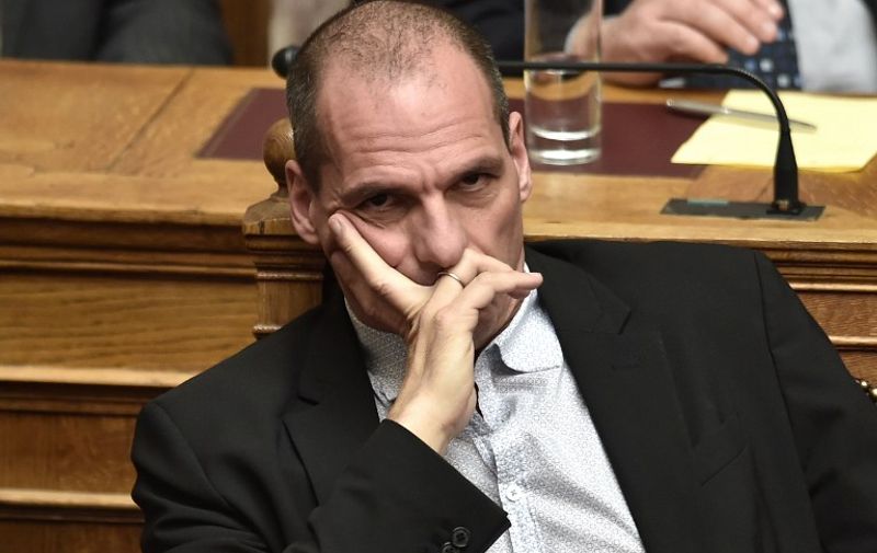 Greek Finance Minister Yanis Varoufakis attends a parliament session in Athens on March 30, 2015. The EU warned Monday that Greece and its creditors had yet to hammer out a new list of reforms despite talks lasting all weekend aimed at staving off bankruptcy and a euro exit. AFP PHOTO / ARIS MESSINIS