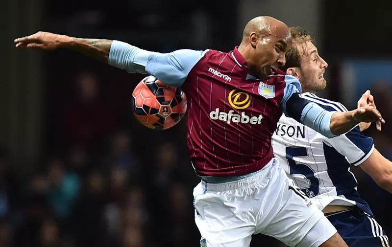Aston Villa's English midfielder Fabian Delph vies with West Bromwich Albion's English defender Craig Dawson (R) during the FA Cup quarter-final match between Aston Villa and West Bromwich Albion at Villa Park in Birmingham, central England on March 7, 2015. AFP PHOTO / BEN STANSALL

RESTRICTED TO EDITORIAL USE. NO USE WITH UNAUTHORIZED AUDIO, VIDEO, DATA, FIXTURE LISTS, CLUB/LEAGUE LOGOS OR "LIVE" SERVICES. ONLINE IN-MATCH USE LIMITED TO 45 IMAGES, NO VIDEO EMULATION. NO USE IN BETTING, GAMES OR SINGLE CLUB/LEAGUE/PLAYER PUBLICATIONS.