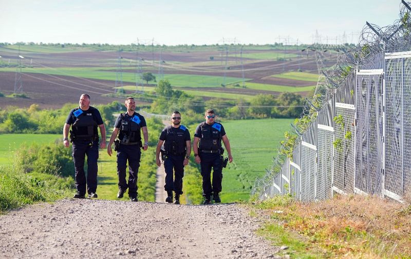 dpatop - 15 April 2024, Bulgaria, Swilengrad: Four German Federal Police officers on Frontex duty walk along the Turkish-Bulgarian "Green Border" during the visit of German Interior Minister Faeser. The talks focus on the implementation of the new common European asylum system, the use of Frontex to protect the EU's external borders and accession to the Schengen area. Photo: Soeren Stache/dpa (Photo by SOEREN STACHE / DPA / dpa Picture-Alliance via AFP)