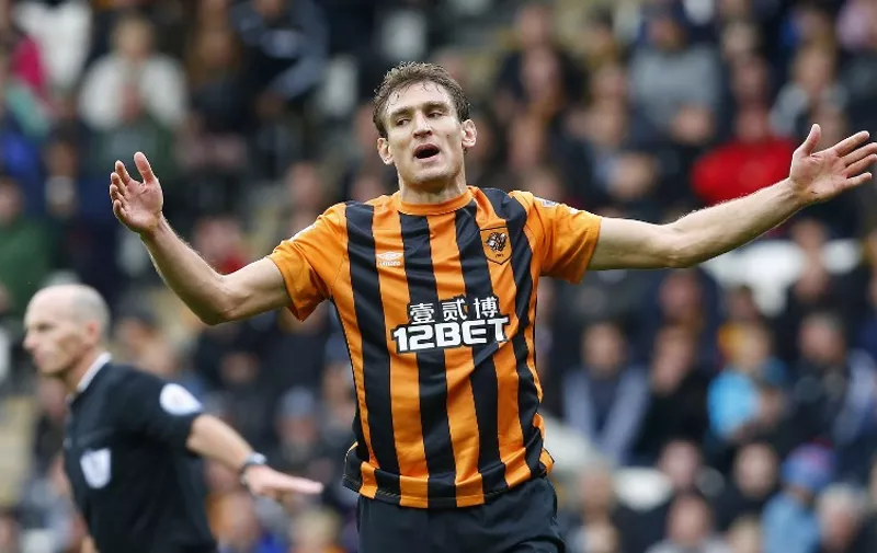 Hull City's Croatian striker Nikica Jelavic reacts after missing a chance during the English Premier League football match between Hull City and Crystal Palace at the KC Stadium in Kingston upon Hull on October 4, 2014.  AFP PHOTO/LINDSEY PARNABY

RESTRICTED TO EDITORIAL USE. No use with unauthorized audio, video, data, fixture lists, club/league logos or "live" services. Online in-match use limited to 45 images, no video emulation. No use in betting, games or single club/league/player publications.