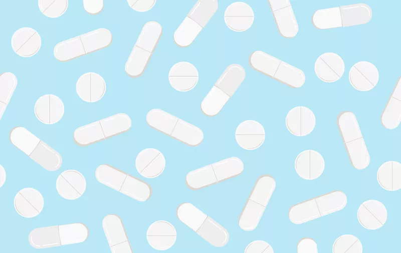 Medicine pills vector flat design seamless pattern. White different circle pills and capsules on blue background. Abstract endless texture for web, covers, decoration, pharmaceutical print design.