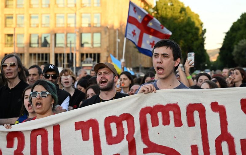 Demonstrators protesting the "foreign influence" law gather for a concert aimed at raising funds to pay police fines of their fellow protesters, in Tbilisi's Republic Square on June 2, 2024. (Photo by Vano SHLAMOV / AFP)
