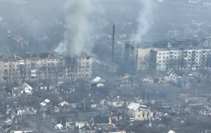 (FILES) This file video grab taken from a shooting by AFPTV shows an aerial view of destructions during fightings in the city of Bakhmut on February 27, 2023. - The chief of the Russian paramilitary group Wagner said on March 3, 2023 his fighters had "practically encircled" Bakhmut, an eastern Ukrainian city that Russia has been trying to seize for months. (Photo by AFPTV / AFP)