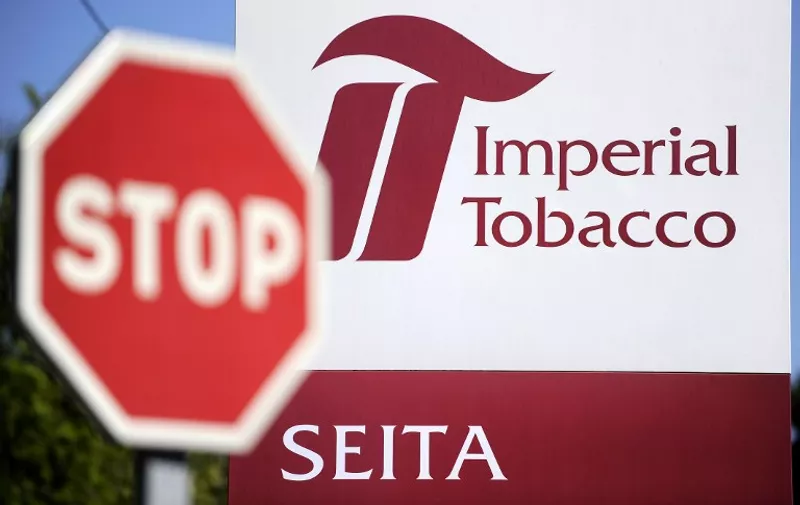 A picture taken on April 15, 2014 shows the facade of the "Seita-Imperial tobacco" plant in Carquefou. Imperial Tobacco today announced the closure of factories in Britain and France with the loss of 900 jobs, citing declining sales in Europe, tougher anti-smoking measures and the growth of contraband sales. The two factories concerned are at Carquefou, near Nantes in western France, where 327 people are employed, and  Nottingham in central England, which has 540 staff.     AFP PHOTO / JEAN-SEBASTIEN EVRARD