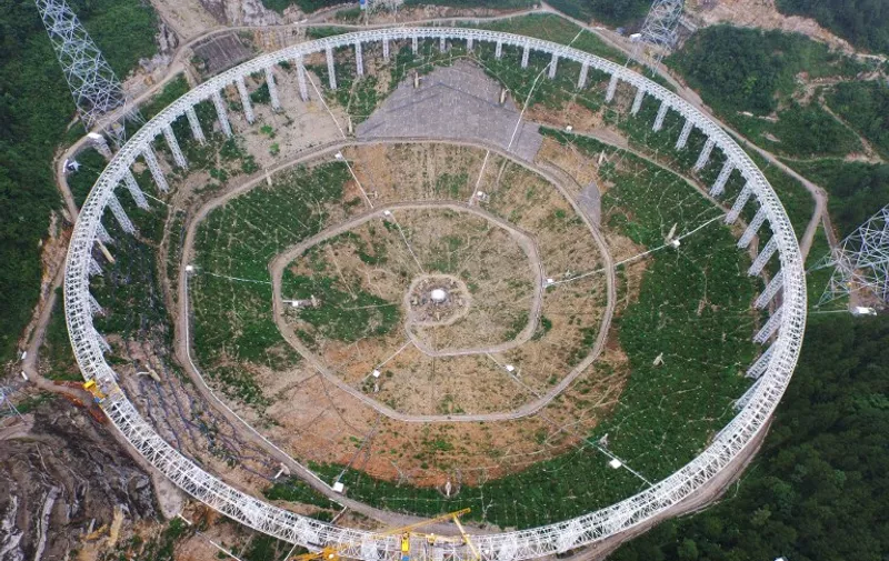 This picture taken on July 29, 2015 shows the five-hundred-metre Aperture Spherical Radio Telescope (FAST) under construction in Pingtang, southwest China's Guizhou province. China has started assembling the world's largest radio telescope, which will have a dish the size of 30 football pitches when completed, state media reported as Beijing steps up its ambitions in outer space. CHINA OUT     