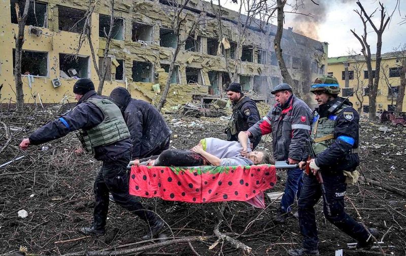 A pregnant woman is carried on a stretcher bed as she is evacuated from a children hospital in Mariupol, southeastern Ukraine, following Russia army bombardment on Wednesday March 9, 2022. The Ukraine Armed Forces who releases this photo does not indicate casualties of the strikes. Ukraine President Volodymyr Zelensky confirms the strike of the maternity hospital in Mariupol, saying in his online post: People, children are under the wreckage. Atrocity! How much longer will the world be an accomplice ignoring terror? Close the sky right now! Stop the killings! You have power but you seem to be losing humanity. The Red Cross say the humanitarian crisis in Mariupol is apocalyptic and worsening by the hour as Russia continues to bombard the besieged Ukrainian city. Mariupol is a city of regional significance in south eastern Ukraine, situated on the north coast of the Sea of Azov at the mouth of the Kalmius river, in the Pryazovia region. It is the tenth-largest city in Ukraine, and the second largest in Donetsk Oblast with a population of 431,859.
Aftermath of airstrike on Maternity Hospital, Mariupol, Ukraine - 09 Mar 2022,Image: 668548648, License: Rights-managed, Restrictions: , Model Release: no, Credit line: Profimedia