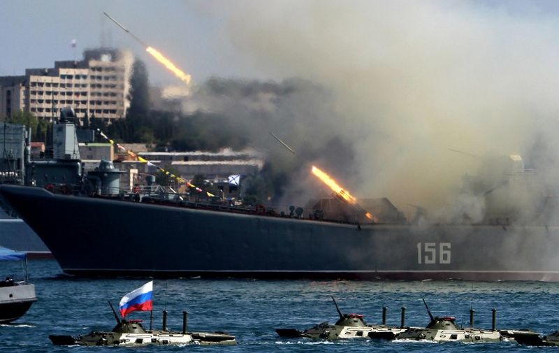 The Yamal, a Ropucha-class landing ship of the Russian Navy, fires rockets during Navy Day celebrations in the Crimean city of Sevastopol on July 27, 2014. Russia announced on July 23, 2014 that it had begun expanding and modernising its Black Sea fleet based in Crimea with new ships and submarines, just months after annexing the peninsula from Ukraine. Russia's Black Sea fleet had a base at the historic port city of Sevastopol in Crimea under an agreement with Ukraine before Russia annexed the peninsula in March 2014. AFP PHOTO / YURI LASHOV