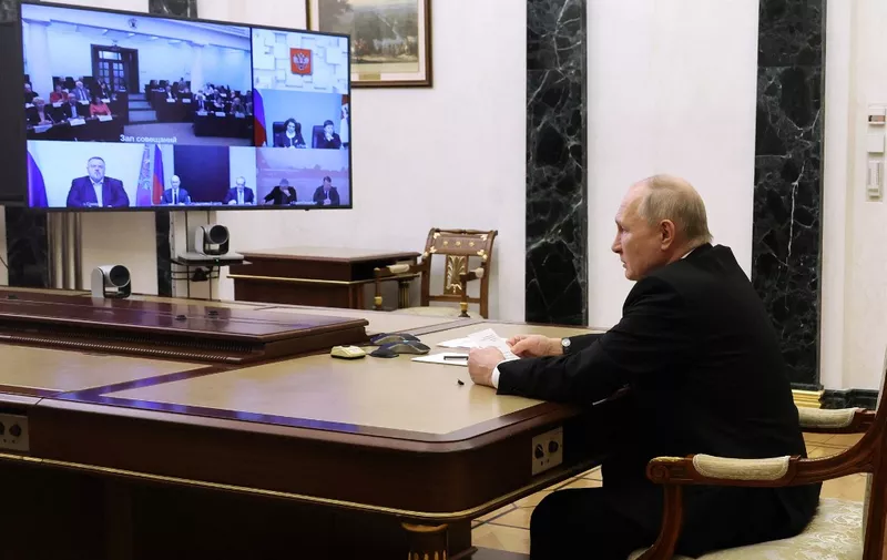 This pool photograph distributed by Russian state agency Sputnik shows Russia's President Vladimir Putin chairing the annual meeting of the Presidential Council for Civil Society and Human Rights, via video conference, in Moscow on December 4, 2023. (Photo by Mikhail KLIMENTYEV / POOL / AFP)