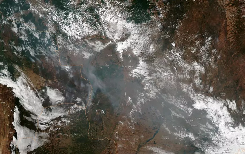This August 21, 2019, satellite image obtained courtesy of the National Oceanic and Atmospheric Administration (NOAA) shows the smoke of several fires in the Brazilian states of Amazonas (top C-L), Para (top R), Mato Grosso (bottom R) and Rondonia (bottom C). - Wildfires in the Amazon rainforest in northern Brazil have ignited a firestorm on social media, with President Jair Bolsonaro on Wednesday suggesting green groups started the blazes. (Photo by HO / NOAA / AFP) / RESTRICTED TO EDITORIAL USE - MANDATORY CREDIT "AFP PHOTO / NOAA" - NO MARKETING NO ADVERTISING CAMPAIGNS - DISTRIBUTED AS A SERVICE TO CLIENTS ---