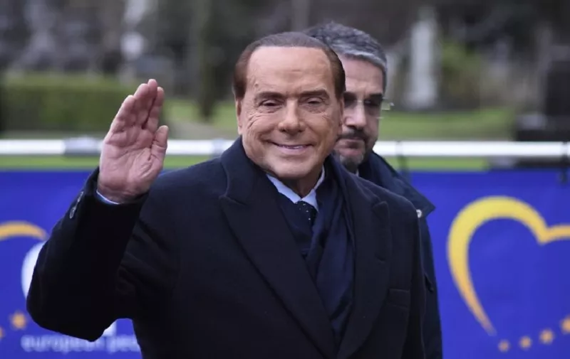 Former Prime Minister and president of Italian right-wing party Forza Italia Silvio Berlusconi (2nd-R) arrives to attend a meeting of the European People's Party (PPE) in Brussels on December 14, 2017, ahead of a summit of European Union (EU) leaders.
European leaders will discuss the migration crisis and defence on December 14, followed by Brexit the day after. / AFP PHOTO / Riccardo PAREGGIANI