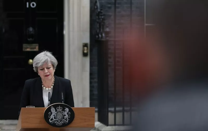 Britain's Prime Minister Theresa May delivers a statement outside 10 Downing Street in central London on May 23, 2017 after an emergency meeting of the Cobra committee in response to a deadly suspected suicide bombing in the northern city of Manchester.
Children were among 22 people killed and dozens injured in a suspected suicide bombing at a pop concert by US star Ariana Grande, in Britain's deadliest terror attack in 12 years. / AFP PHOTO / Daniel LEAL-OLIVAS
