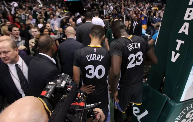 MILWAUKEE, WI - DECEMBER 12: Stephen Curry #30 of the Golden State Warriors and Draymond Green #23 walk off the court after the 95-108 loss to the Milwaukee Bucks at BMO Harris Bradley Center on December 12, 2015 in Milwaukee, Wisconsin. NOTE TO USER: User expressly acknowledges and agrees that, by downloading and or using this photograph, User is consenting to the terms and conditions of the Getty Images License Agreement.   Mike McGinnis/Getty Images/AFP