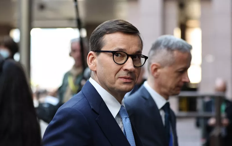 Poland's Prime Minister Mateusz Morawiecki arrives for a European Union (EU) summit at EU Headquarters in Brussels on March 24, 2022. (Photo by Aris Oikonomou / AFP)