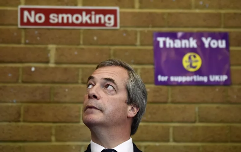 (FILES) In a file picture taken on April 13, 2015 UK Independence Party (UKIP) leader Nigel Farage attends a coffee morning at Coppins Community Centre in Clacton-On-Sea in Essex during a general election campaign visit. Nigel Farage's resignation as UKIP leader was rejected by the party it was announced on May 11 who persuaded Farage to stay on as leader of anti-EU party. Farage announced his resignation after failing to be elected to the parliamentary seat of Thanet South.  AFP PHOTO / BEN STANSALL
