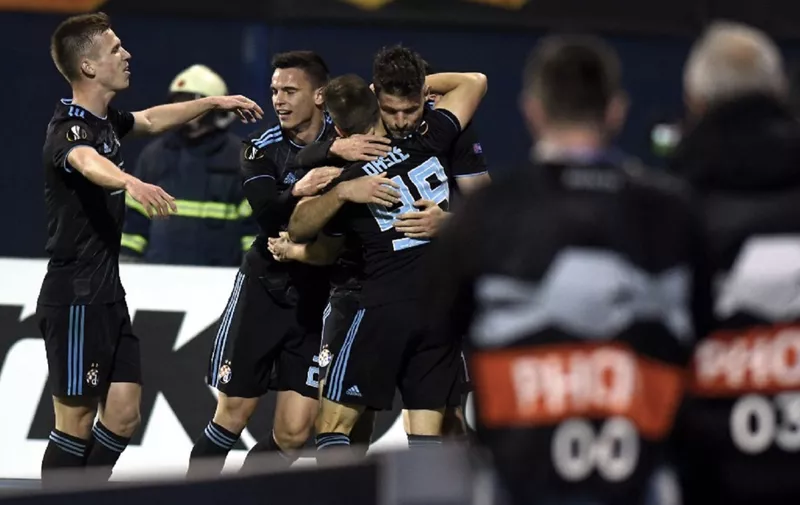 Dinamo Zagreb's players celebrate after scoring their third goal during the UEFA Europa League round of 32 second-leg football match between Dinamo Zagreb and Viktoria Plzen at the Maksimir stadium in Zagreb, Croatia, on February 21, 2019. (Photo by Denis LOVROVIC / AFP)