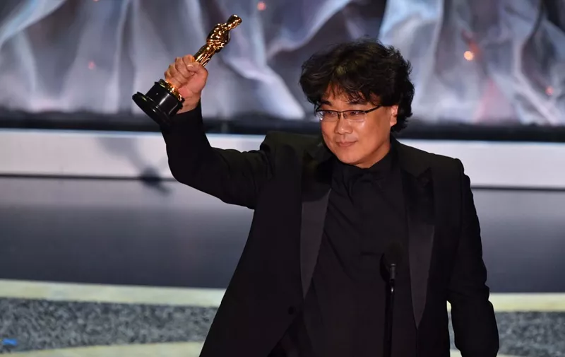 South Korean director Bong Joon-ho accepts the award for Best International Feature Film for "Parasite" during the 92nd Oscars at the Dolby Theatre in Hollywood, California on February 9, 2020. (Photo by Mark RALSTON / AFP)