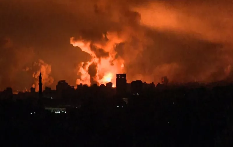 This image grab from an AFP TV footage shows balls of fire and smoke rising above Gaza City during an Israeli strike on October 27, 2023, as battles between Israel and the Palestinian Hamas movement continue. The Israeli army on the evening of October 27 carried out bombings of "unprecedented" intensity since the start of the war in the north of the Gaza Strip, particularly in Gaza City, according to images from AFP and the Hamas movement. (Photo by AFP)